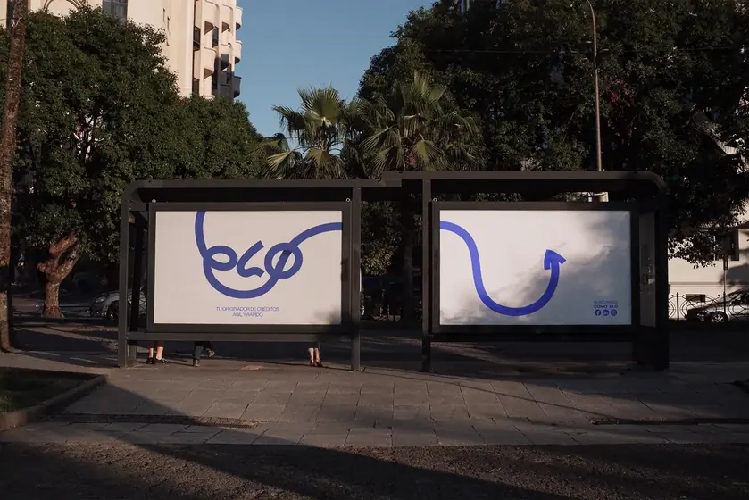 Bus shelter with two ELO Avanta ads, the logo drawn as one continuous blue line ending in an arrow
