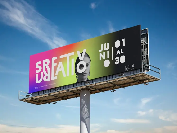 Surreativo billboard with the logo over a rainbow gradient, a black and white portrait and the dates June 1 to 30