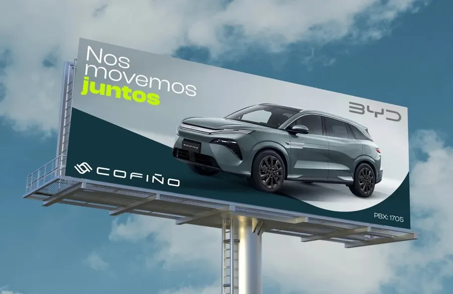 Cofiño billboard against a cloudy sky with a BYD SUV and the headline Nos movemos juntos, by CBAS